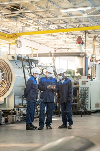 Technicians installing industrial refrigeration equipment
